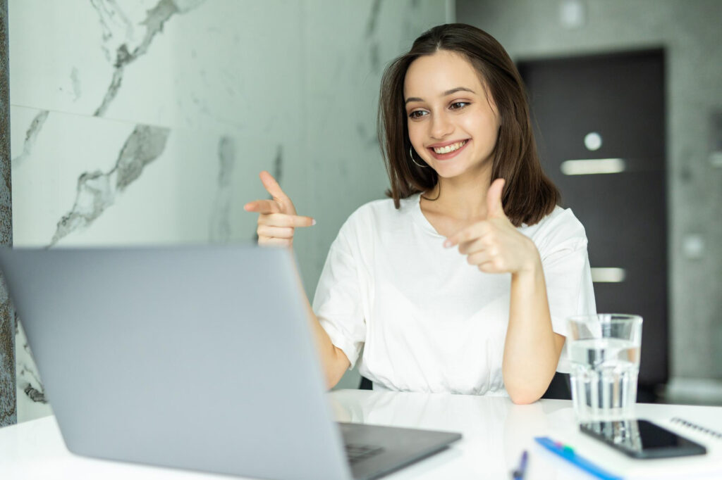 Young Beautiful Woman Standing Kitchen Indoors Home Using Laptop Computer Cooking 1024x682
